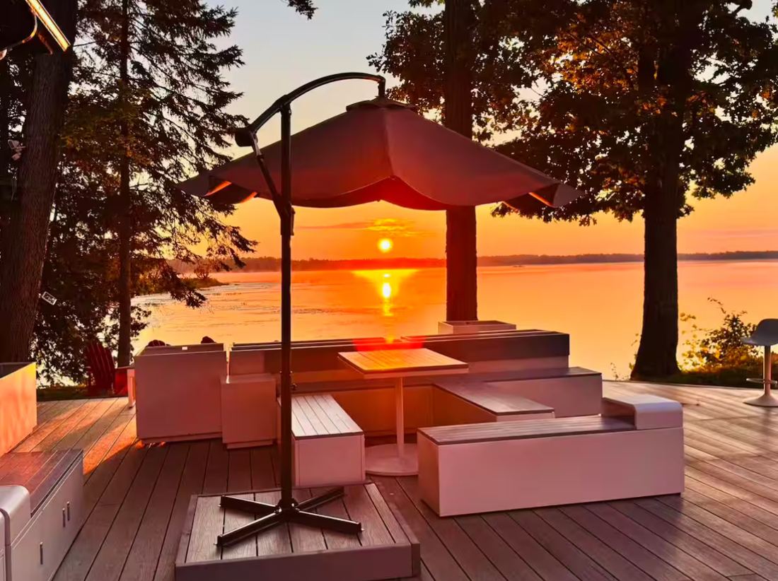 Sunset over the lake from the estate's deck, patio umbrella in the foreground